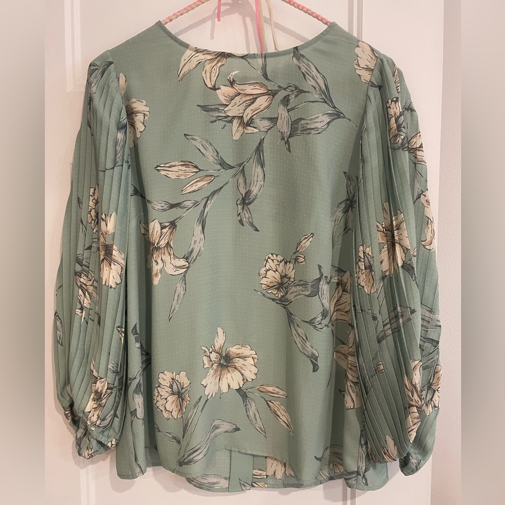 Beautiful turquoise crepe blouse. Very good quality material.